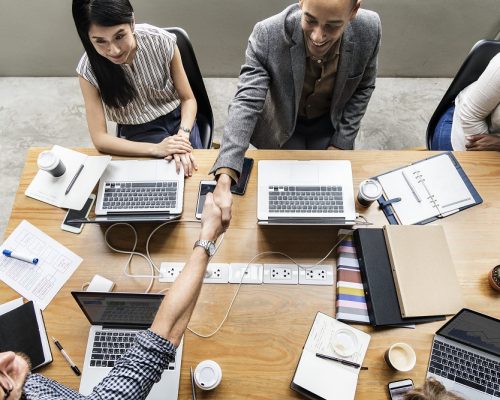 Business people shaking hands in agreement